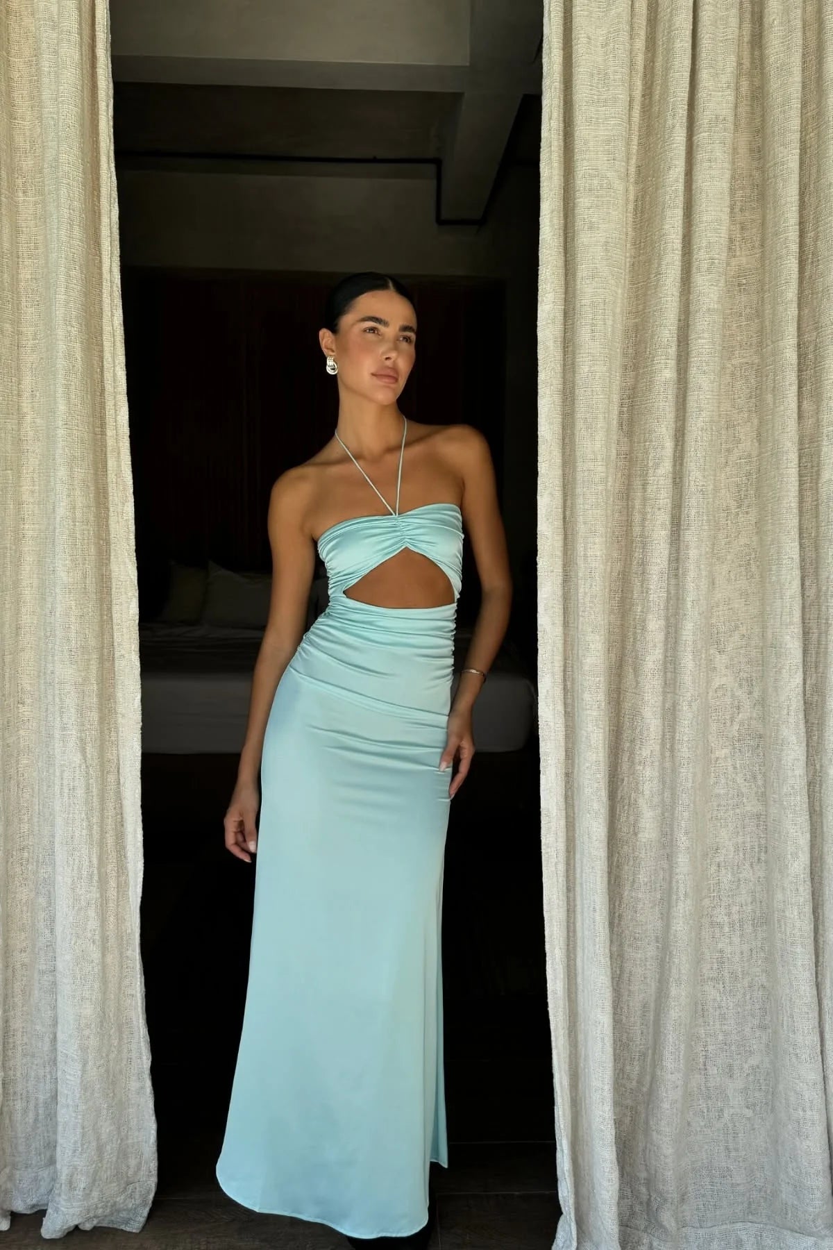 Front view of Loverlm aqua satin evening dress with a halter neckline, front cutout, ruched waist and ankle-length skirt.
