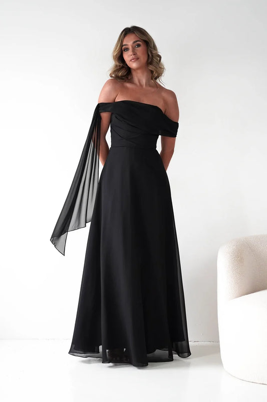 Loverlm black A-line evening dress with asymmetric off-shoulder neckline, pleated bodice, sheer shoulder drape and flowing floor-length skirt front view