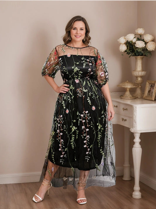 Black floral embroidered Mother of the Bride Dress with sheer round neckline, puff sleeves, defined waist and flowing A-line midi skirt by Loverlm.