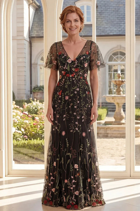 Loverlm black floral embroidered tulle gown with a V-neck, sheer flutter sleeves, fitted waist and floor-length A-line skirt.