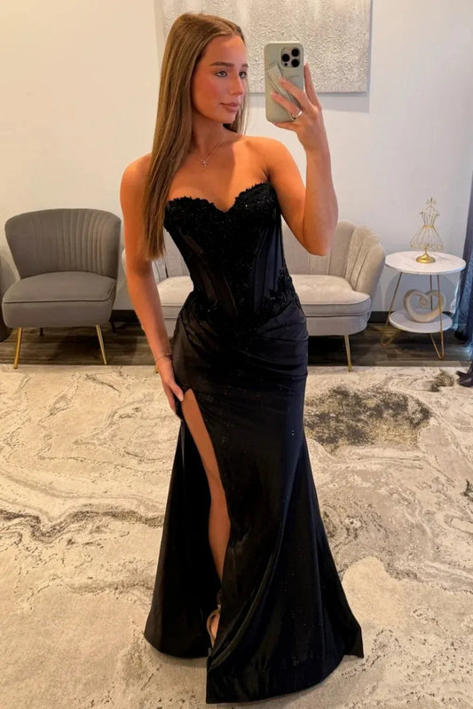 Loverlm black satin and lace mermaid evening dress with a strapless sweetheart bodice, ruched hips, high front slit and flowing hem.