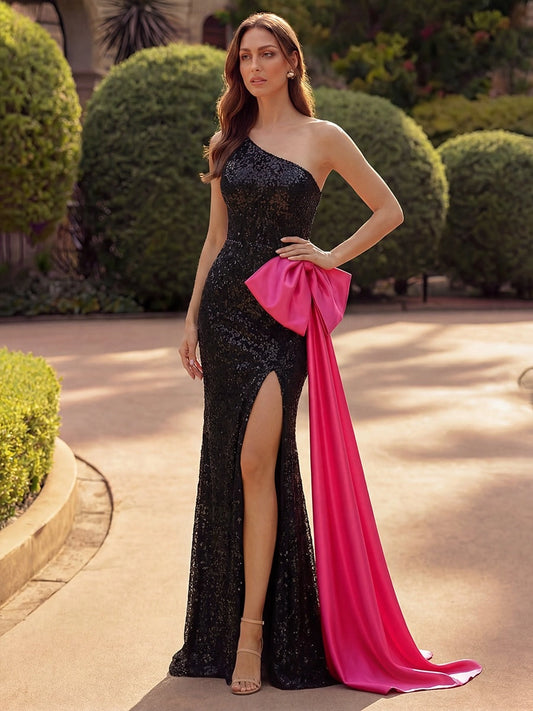 Front view of Loverlm black sequined one-shoulder evening dress with high slit and hot pink satin bow train
