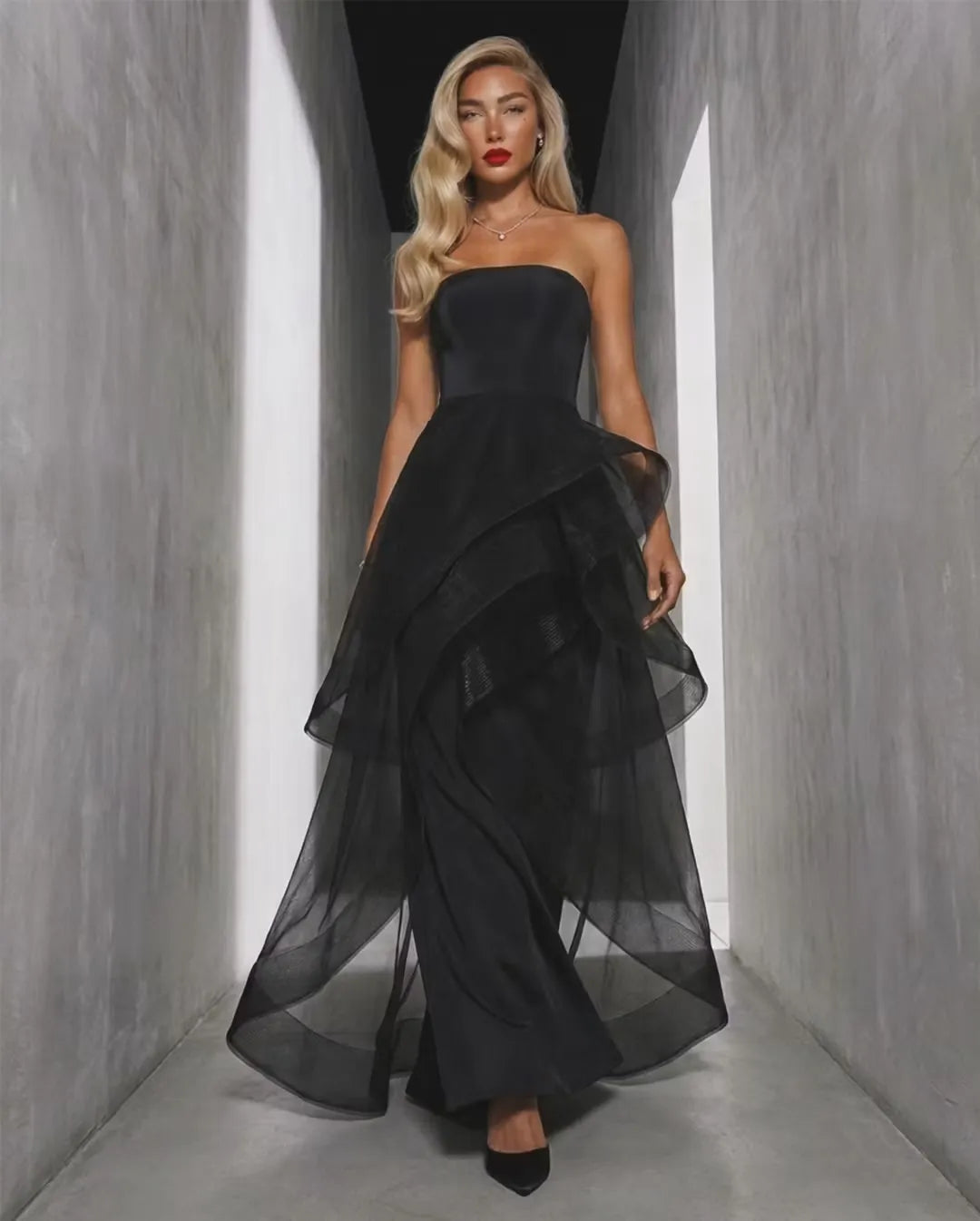 Loverlm black strapless evening dress with straight neckline fitted bodice and dramatic layered sheer ruffle floor-length skirt