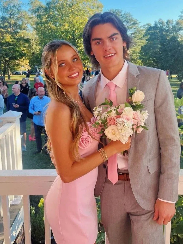 Loverlm blush pink strapless mini homecoming dress featuring oversized 3D rosettes along the neckline and a fitted bodycon silhouette, front view