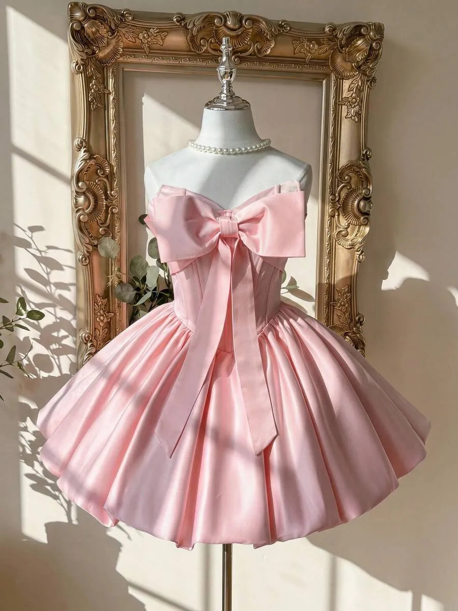 Loverlm blush pink homecoming dress with oversized bow strapless corset bodice and full satin mini skirt