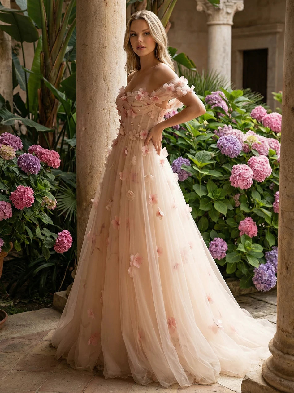 Blush pink A-line tulle bridesmaid dress with sweetheart neckline, off-shoulder floral sleeves, 3D flower appliques, corset bodice and floor-length skirt by Loverlm