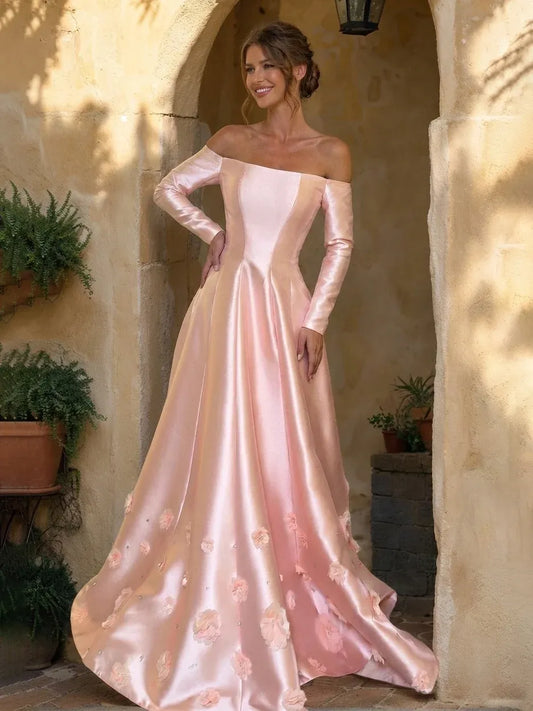 Front view of Loverlm blush pink off-shoulder long sleeve prom dress with 3D floral appliques and floor-length A-line skirt