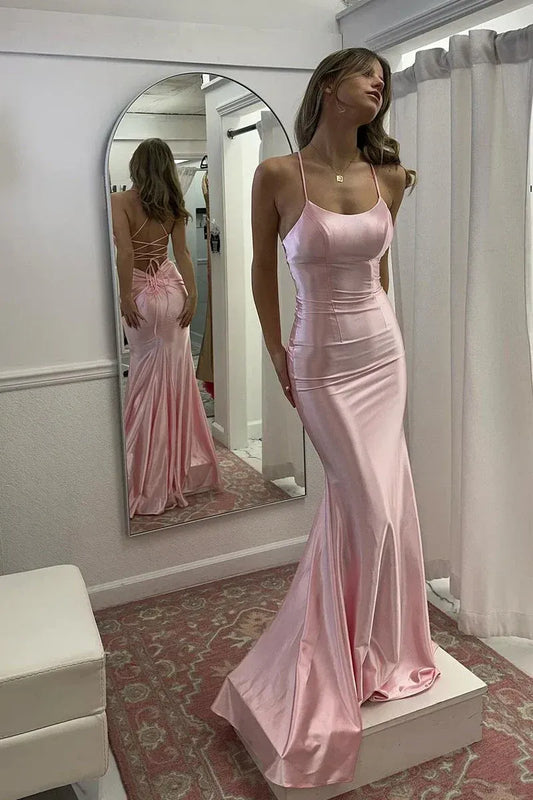 Front view of Loverlm blush pink satin mermaid prom dress with a scoop neckline, spaghetti straps and a flared floor-length skirt.