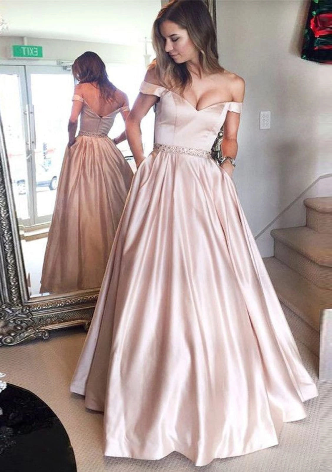 Loverlm blush pink satin ball gown prom dress with sweetheart off shoulder neckline beaded waist pockets and full floor length skirt front view