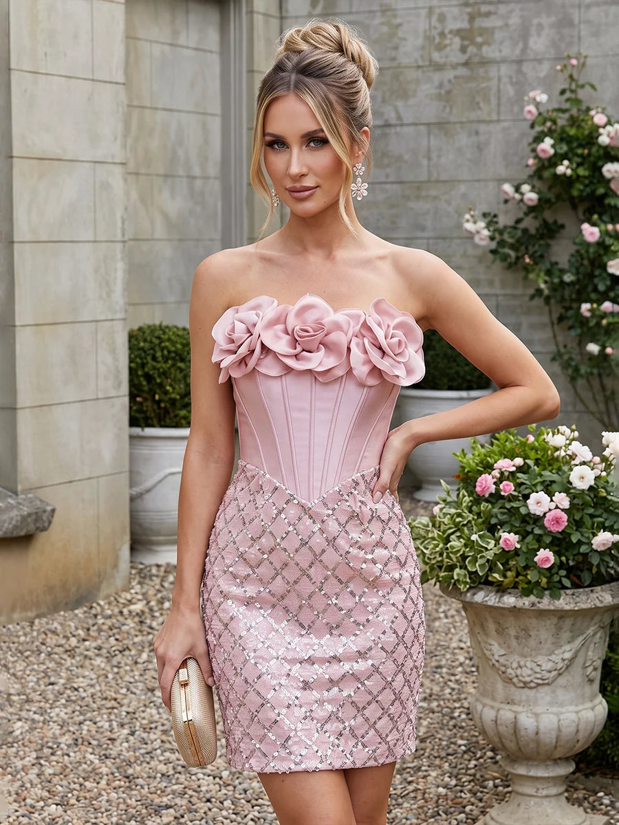 Blush pink strapless mini homecoming dress with 3D satin roses, structured corset bodice, sweetheart neckline and sparkling diamond sequin skirt by Loverlm