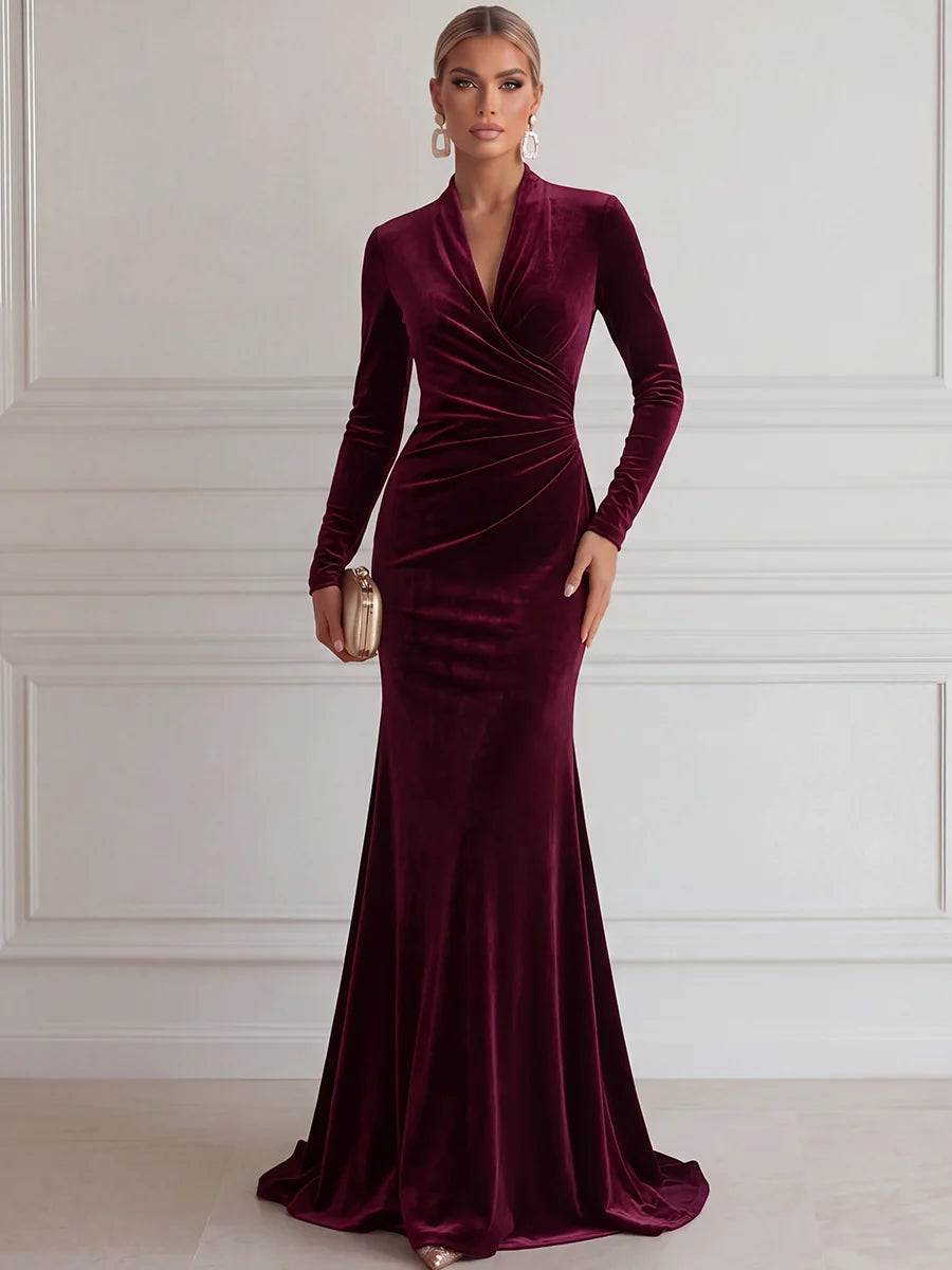 Burgundy velvet mermaid evening dress with deep V neckline long sleeves and ruched bodice by Loverlm