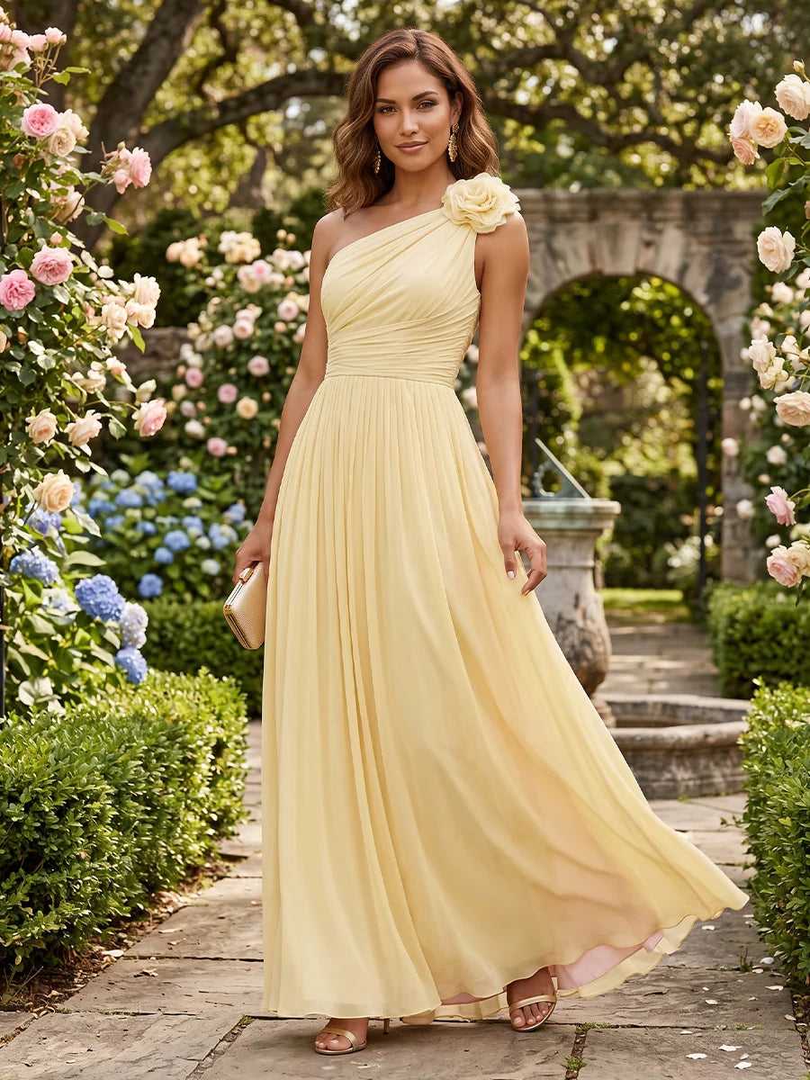 Butter yellow A-line chiffon evening dress with one-shoulder neckline, 3D rose shoulder detail, ruched bodice and flowing pleated floor-length skirt by Loverlm