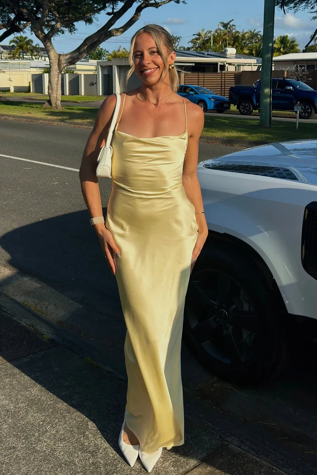 Loverlm butter yellow satin prom dress with cowl neckline, spaghetti straps and sleek floor length sheath silhouette front view