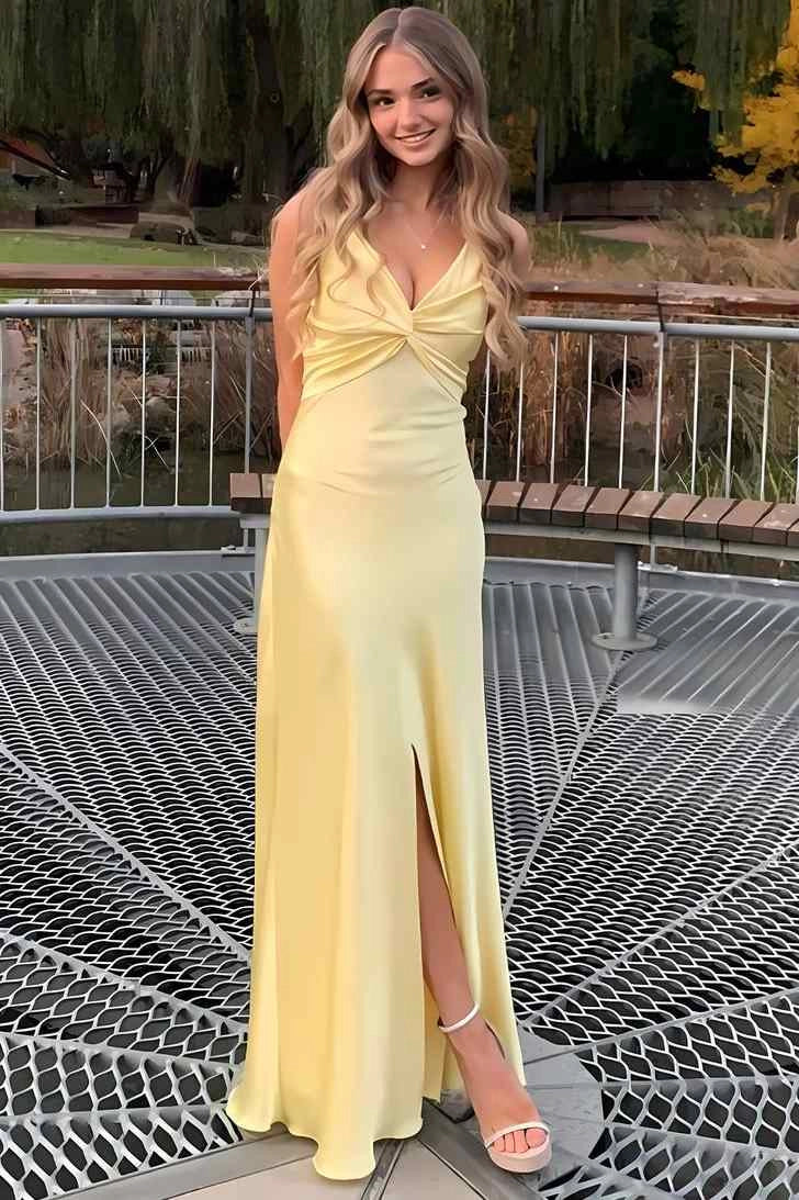 Front view of Loverlm butter yellow prom dress with a twisted V-neck bodice, spaghetti straps and a floor-length skirt with a slit.