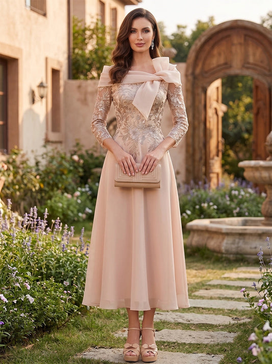 Loverlm champagne blush A-line mother of the bride dress with off-shoulder bow neckline, embroidered lace sleeves and midi skirt front view