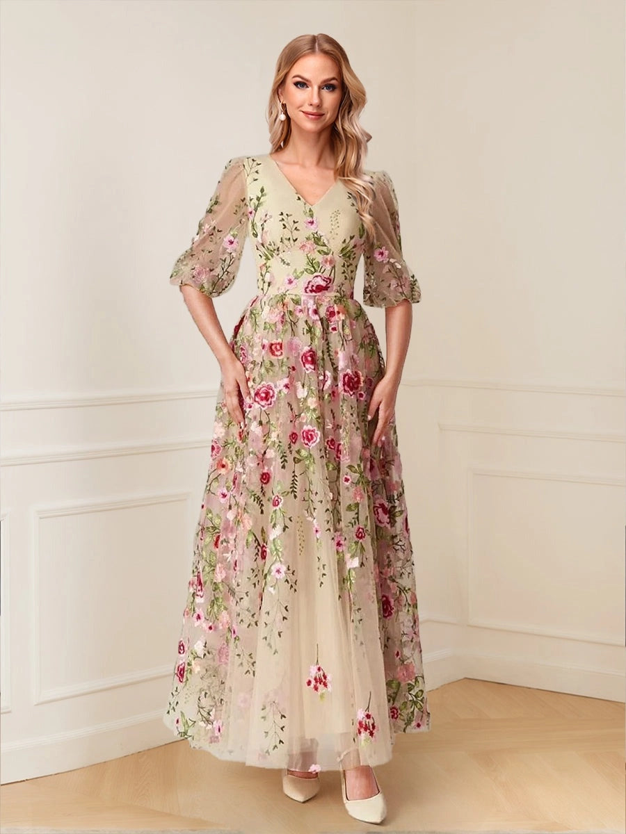 Loverlm champagne A-line wedding guest dress with V-neckline, sheer puff sleeves, pink floral embroidery and flowing ankle-length skirt, front view