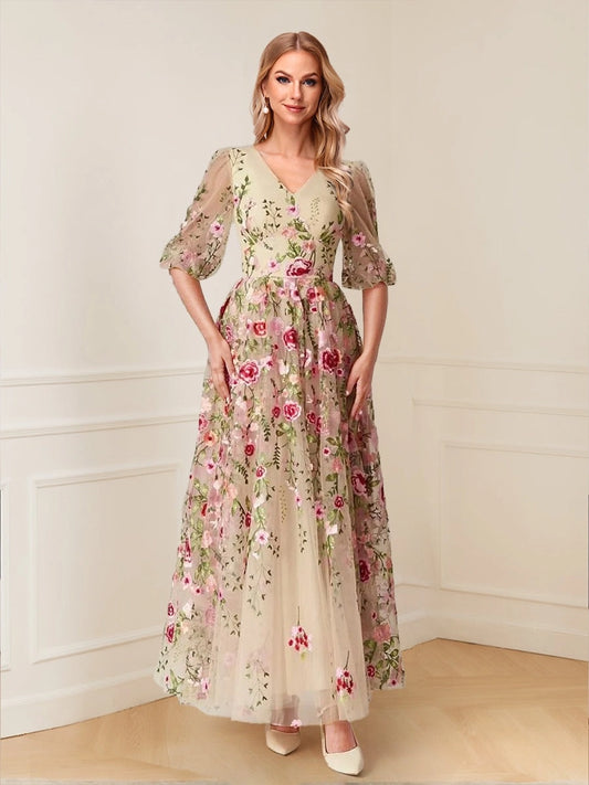 Loverlm champagne A-line wedding guest dress with V-neckline, sheer puff sleeves, pink floral embroidery and flowing ankle-length skirt, front view