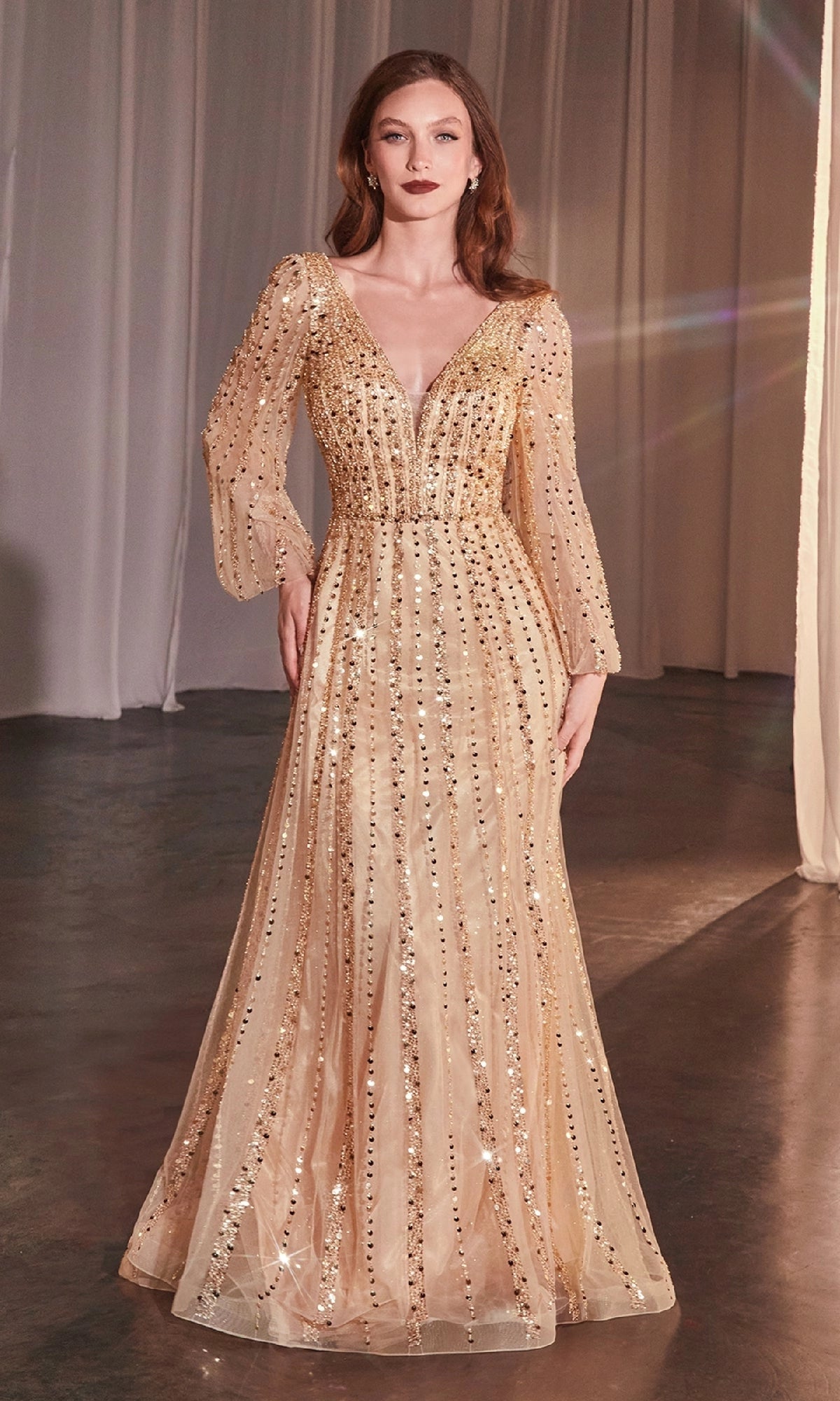 Champagne gold A-line evening dress with plunging V-neckline, sheer long sleeves, sparkling sequin beadwork and floor-length tulle skirt by Loverlm