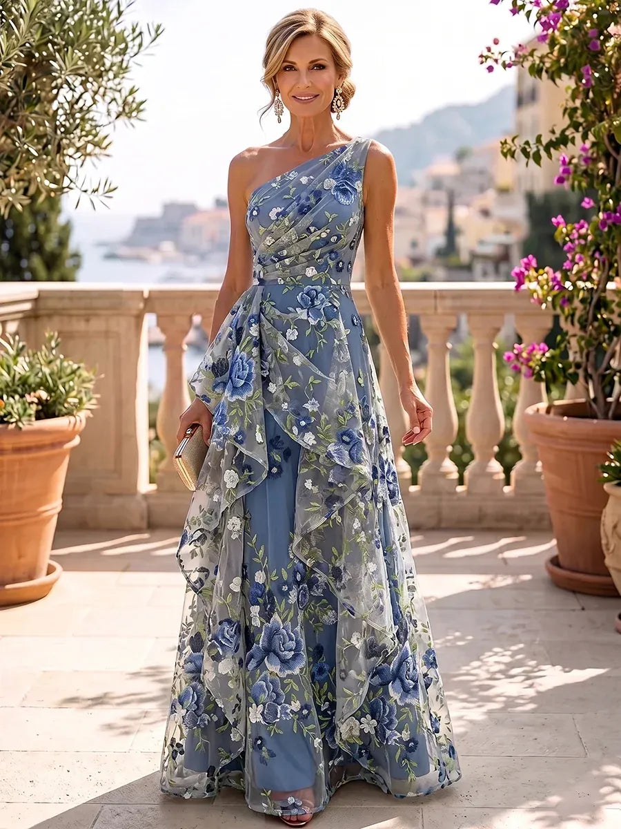 Loverlm dusty blue floral tulle gown with a one-shoulder neckline, pleated bodice and cascading ruffles on a floor-length A-line skirt.
