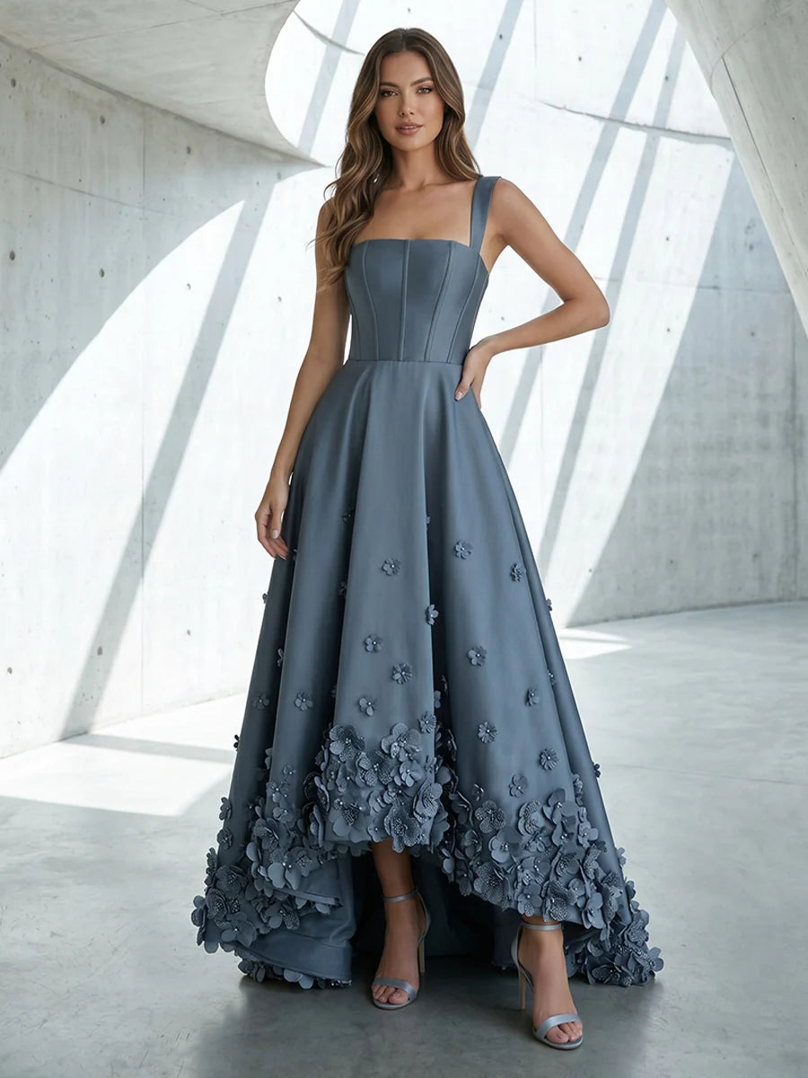 Dusty blue satin high low prom dress with square neckline, wide shoulder straps, structured bodice and 3D floral applique A-line skirt by Loverlm