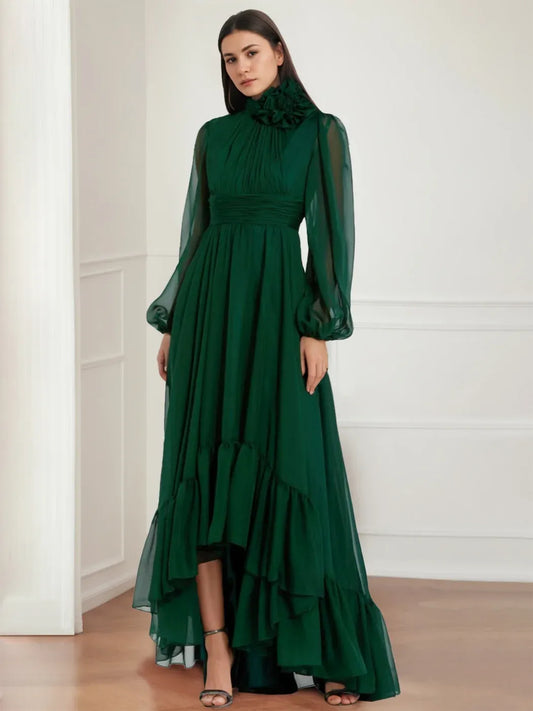 Front view of Loverlm emerald green wedding guest dress with high neckline, sheer long sleeves, ruched waist and tiered high-low skirt