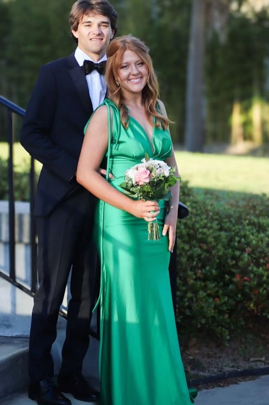 Front view of a Loverlm emerald green satin mermaid prom dress with a plunging V-neckline, spaghetti straps, tied shoulder details, and floor-length skirt.