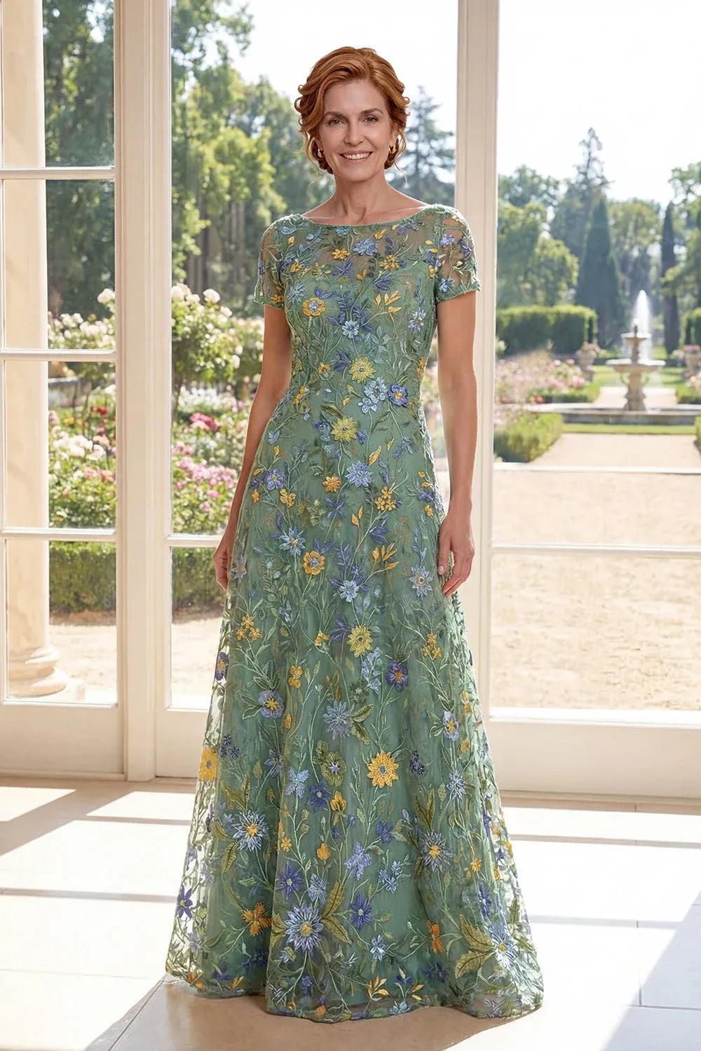 Loverlm green floral embroidered tulle gown with a bateau neckline, sheer short sleeves, fitted waist and floor-length A-line skirt.