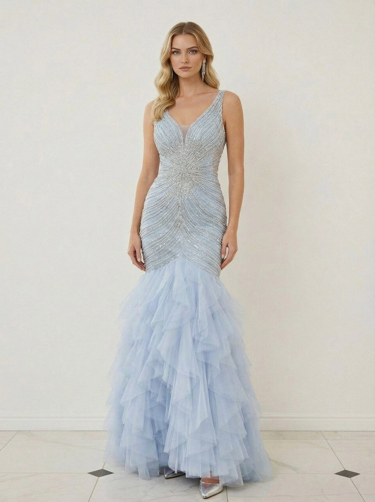 Light blue beaded tulle mermaid prom dress with deep V-neck and layered ruffle skirt