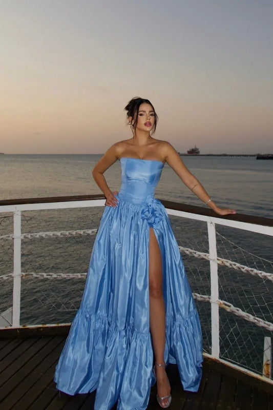 Loverlm light blue strapless A-line prom dress with a fitted bodice, floral waist accent, high slit and tiered floor-length skirt.