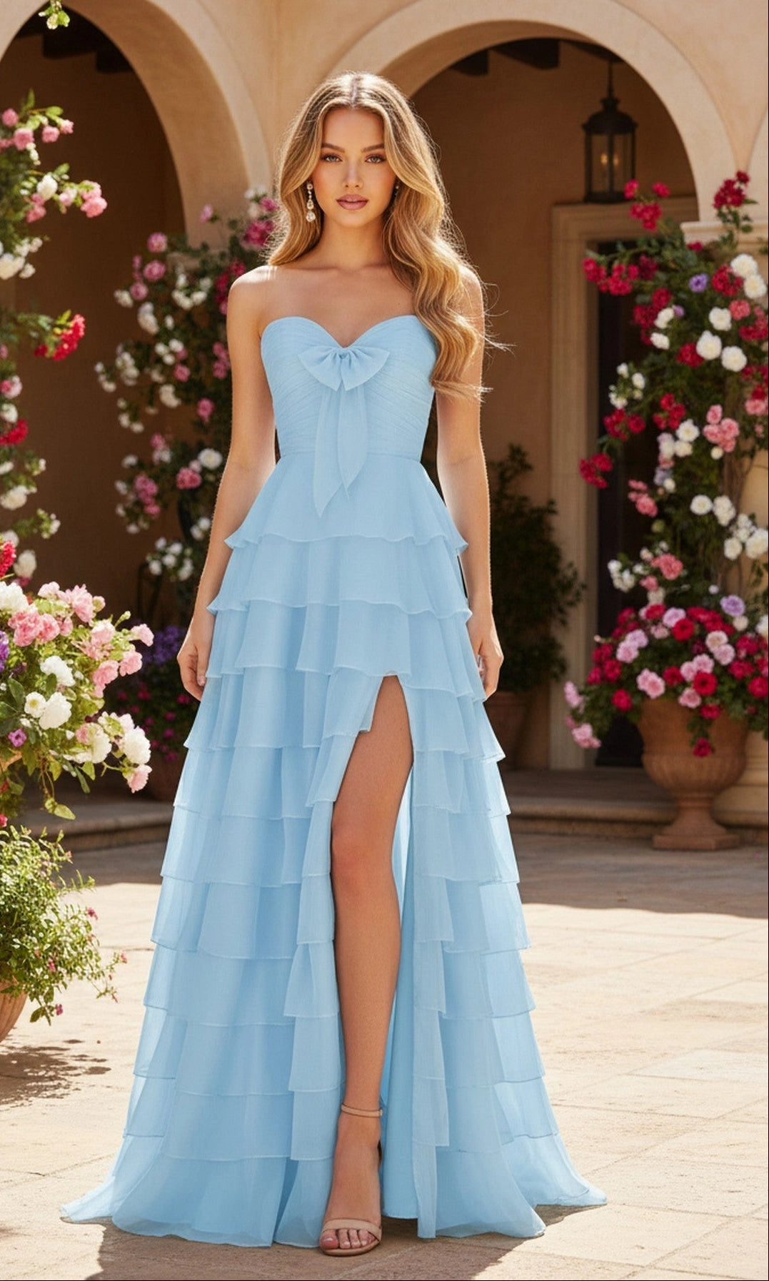 Light blue A-line chiffon prom dress with strapless sweetheart neckline, front bow, ruched bodice, tiered ruffle skirt and thigh-high slit by Loverlm