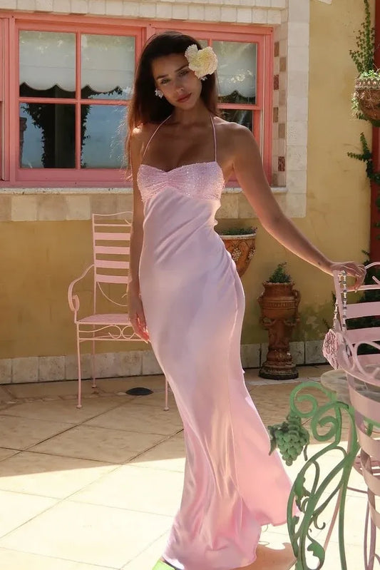 Front view of Loverlm light pink satin prom dress with a beaded sweetheart bust, thin halter straps and a floor-length sheath skirt.