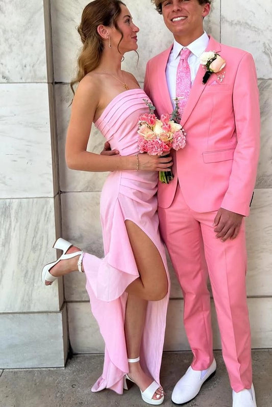 Front view of a Loverlm light pink satin sheath prom dress with a strapless ruched bodice, high side slit, asymmetrical draped skirt, and floor-length sweep.