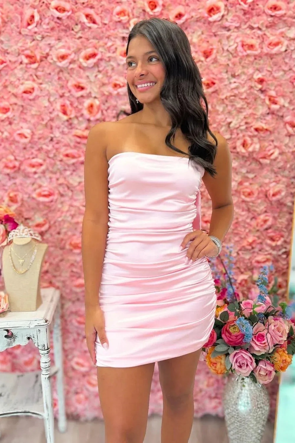 Loverlm light pink satin strapless mini homecoming dress with ruched fitted bodice and sheath silhouette front view