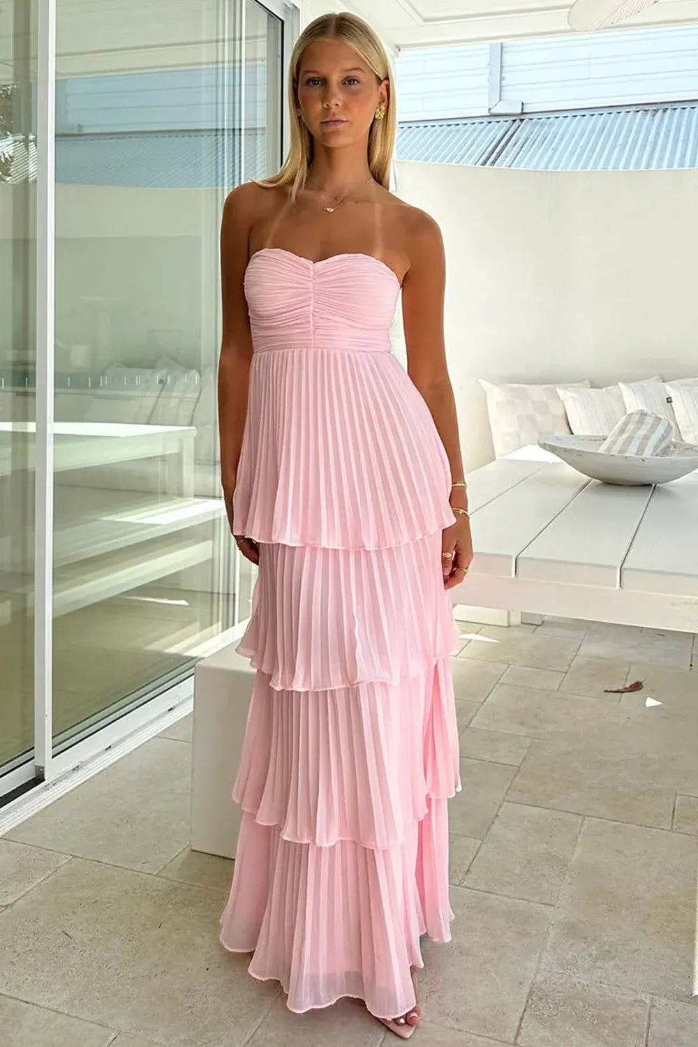 Loverlm light pink strapless chiffon dress with a ruched sweetheart bodice and four tiers of vertically pleated fabric.