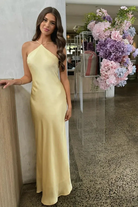Loverlm light yellow satin wedding guest dress with a pointed halter neckline, delicate straps and a flowing floor-length skirt.