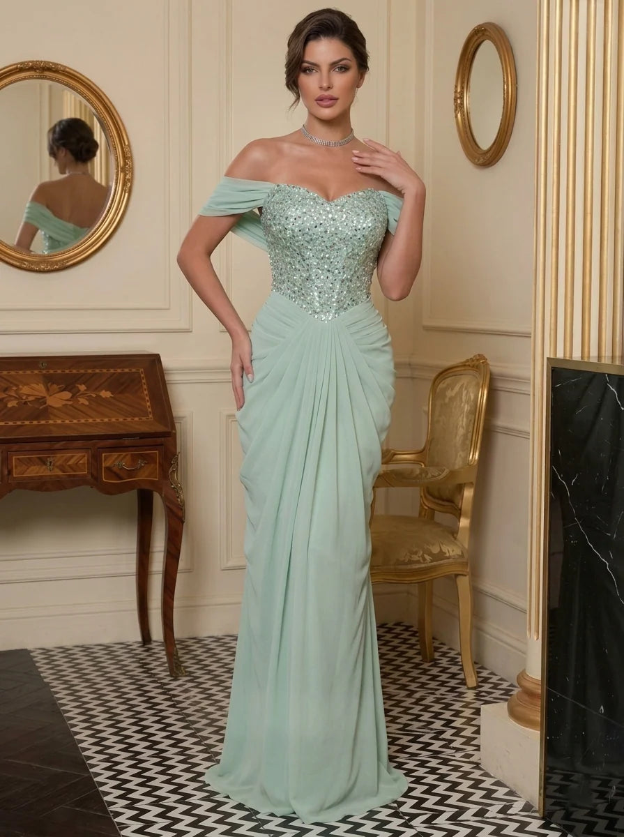 Mint green chiffon evening dress with off shoulder draped sleeves, sparkling sequin sweetheart corset bodice, ruched hips and floor-length sheath skirt by Loverlm