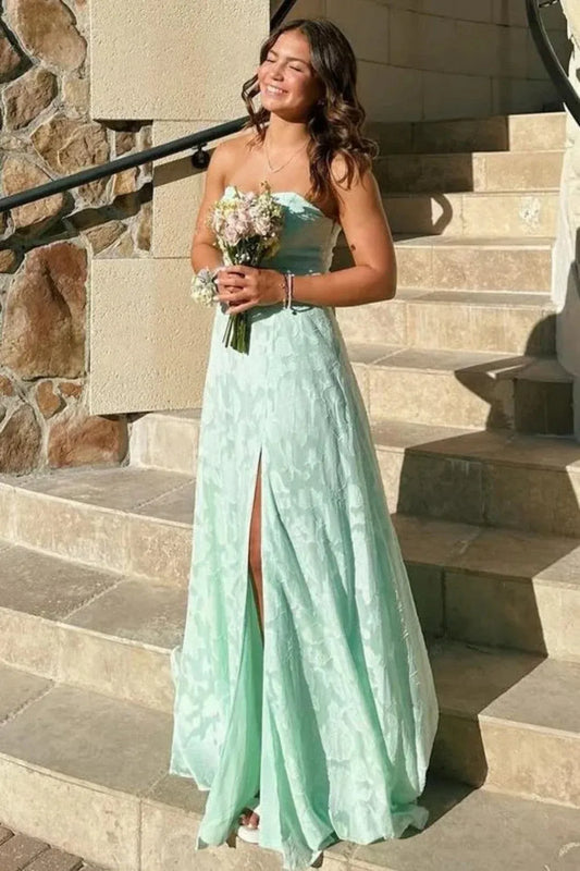 Front view of Loverlm mint green strapless prom dress with tonal floral texture, a fitted waist and a floor-length A-line skirt with a front slit.