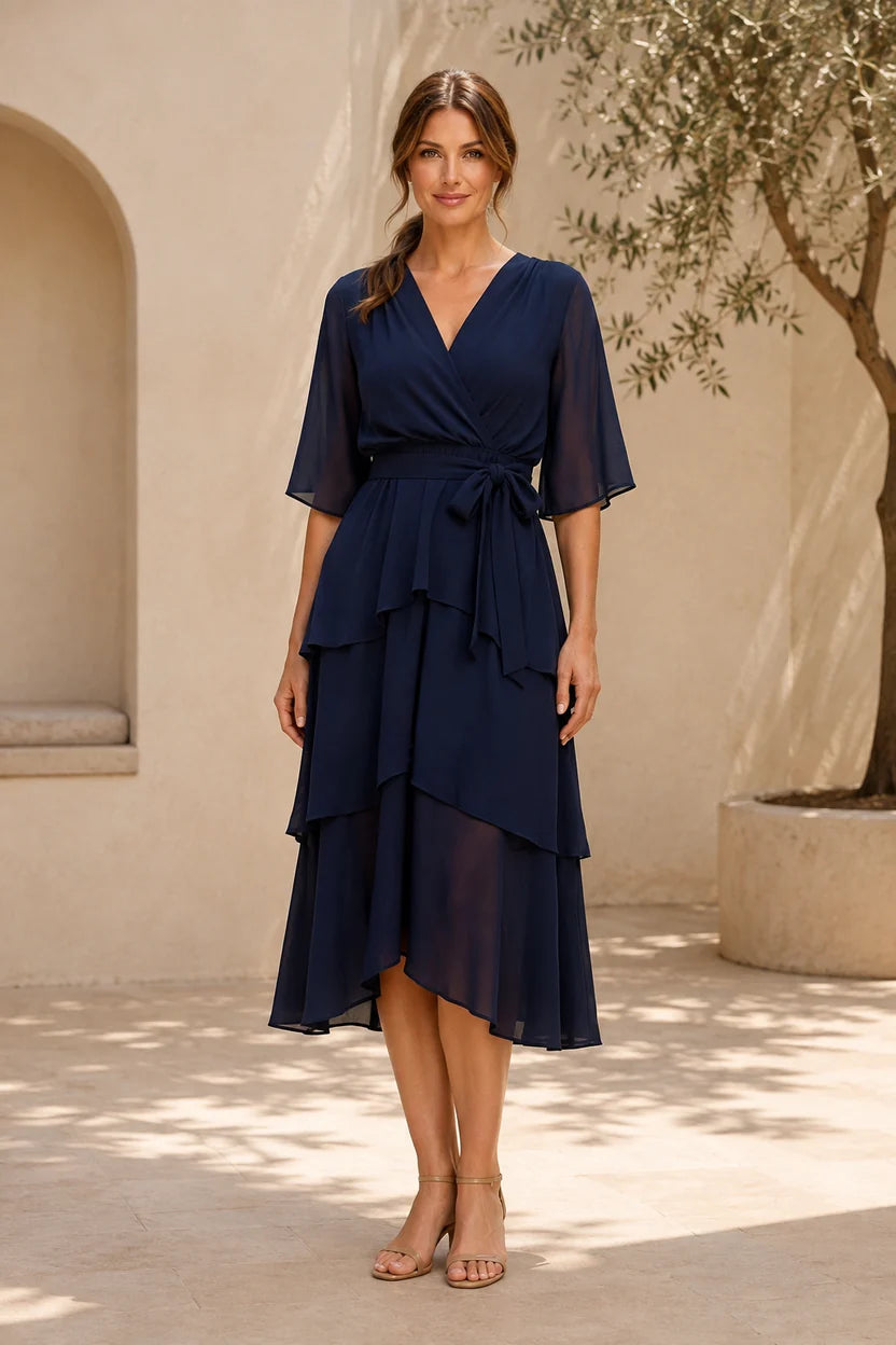 Loverlm navy blue chiffon midi wedding guest dress with V-neck, flutter sleeves, tie waist and asymmetric tiered skirt front view