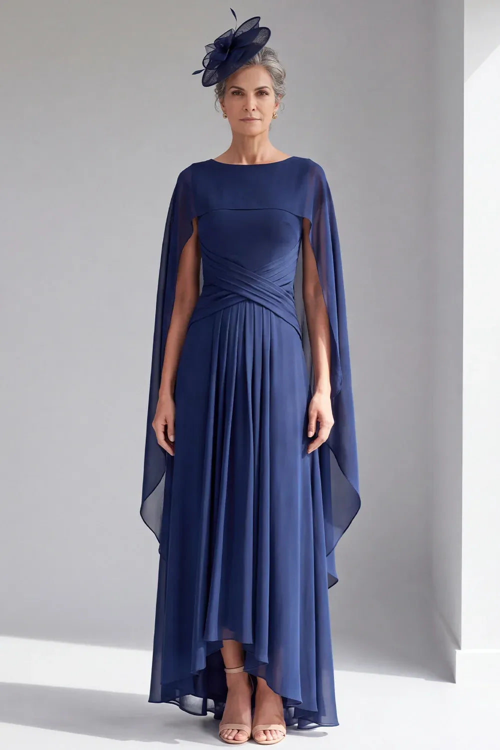 Loverlm navy chiffon dress with a bateau neckline, long cape sleeves, crisscross waist pleats and a gathered high-low skirt.