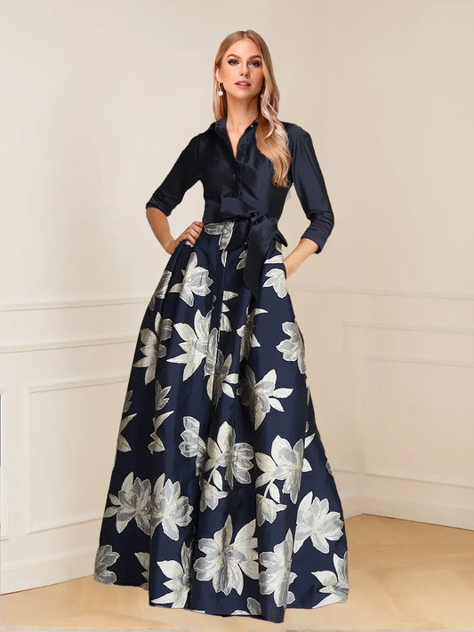 Loverlm navy floral Mother of the Bride dress with collared neckline, three-quarter sleeves, bow waist sash and floor-length A-line skirt front view