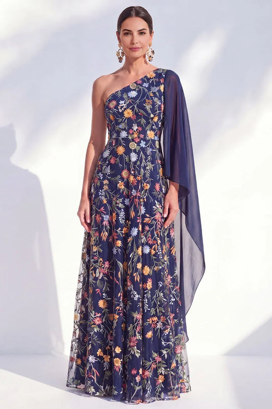 Loverlm navy floor-length wedding guest dress with colorful floral embroidery, a one-shoulder neckline and a sheer chiffon cape sleeve, front view.
