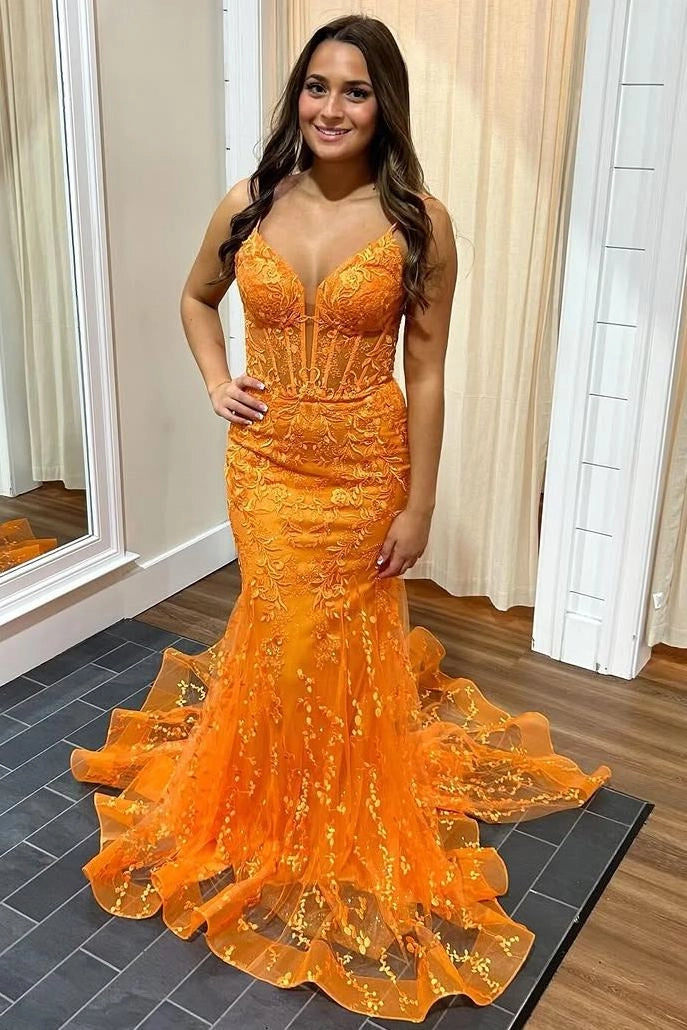 Front view of a Loverlm orange lace tulle mermaid prom dress with a sweetheart neckline, spaghetti straps, floral appliqués, and a sweeping train.
