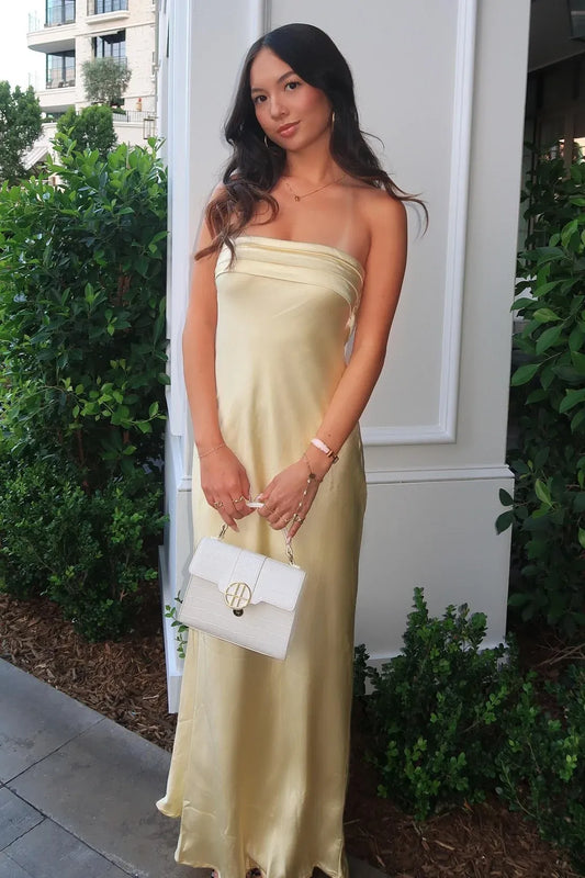 Loverlm pale yellow satin strapless maxi dress with a pleated bandeau neckline, smooth sheath silhouette and softly flowing skirt.