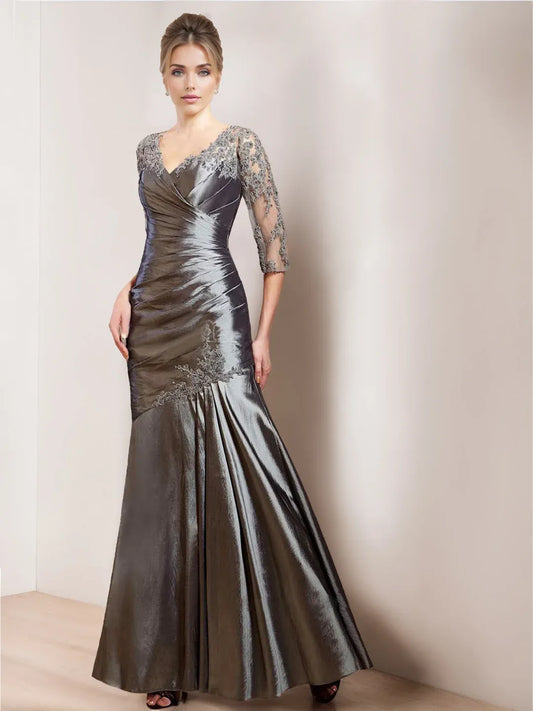Front view of Loverlm pewter gray mother of the bride dress with V-neckline, sheer embroidered half sleeves, ruched bodice and mermaid skirt