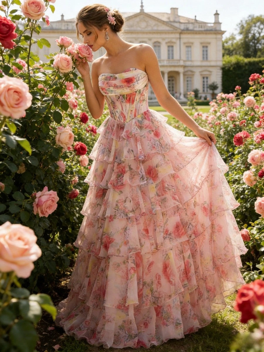 Pink floral tulle strapless corset prom dress with tiered ruffle skirt front view
