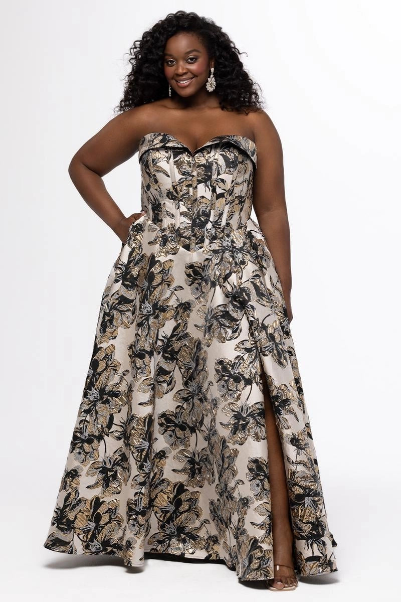 Plus size black and gold floral jacquard A-line prom dress with strapless sweetheart neckline, structured corset bodice, oversized side bow, and full floor-length skirt