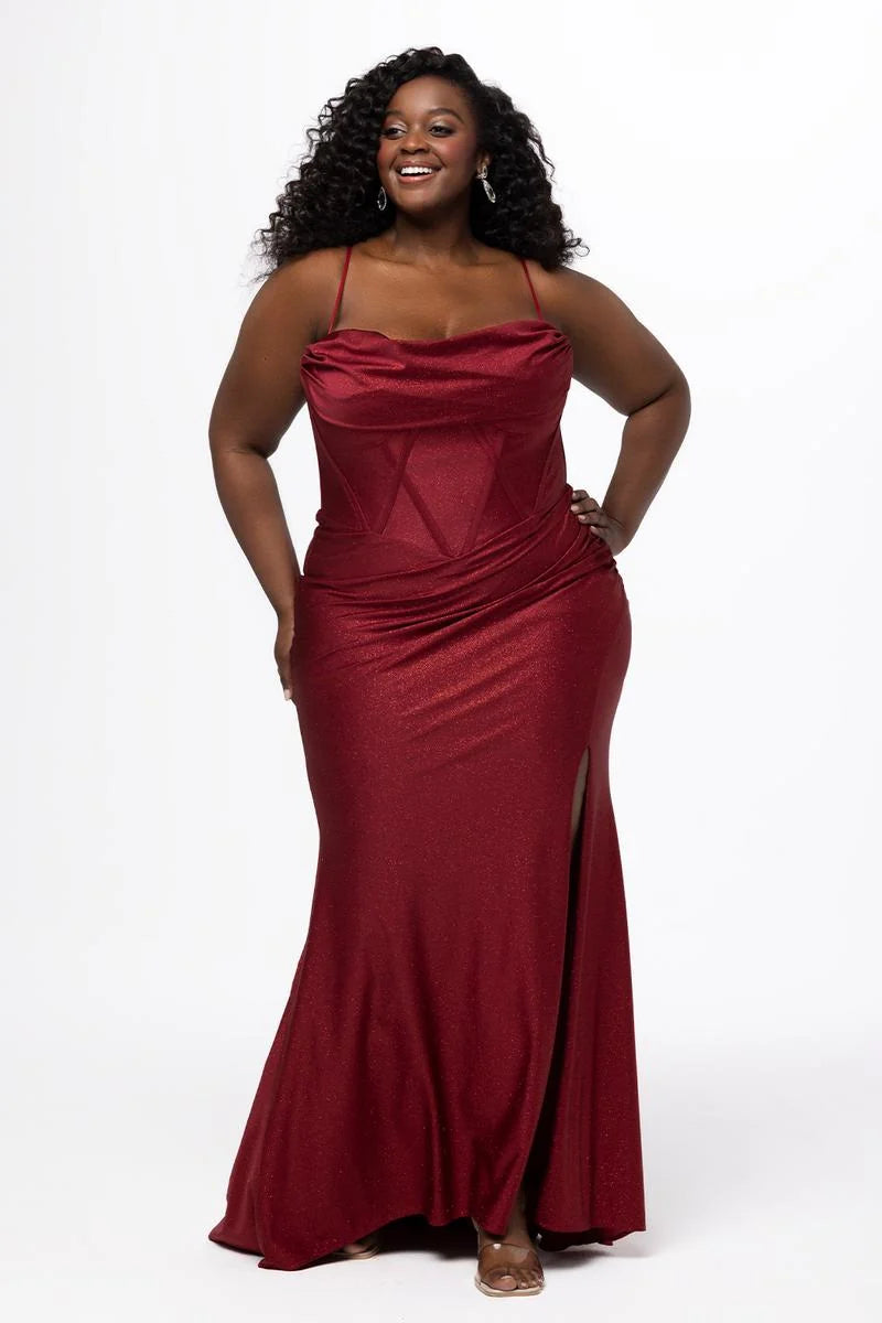 Plus size burgundy glitter mermaid prom dress with draped cowl neckline, spaghetti straps, structured corset bodice, ruched waist, and thigh-high slit