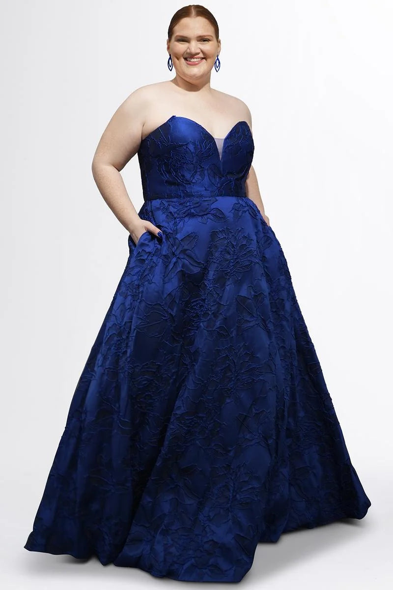 Plus size midnight blue floral jacquard A-line prom dress with strapless sweetheart neckline, structured bodice, and full floor-length skirt