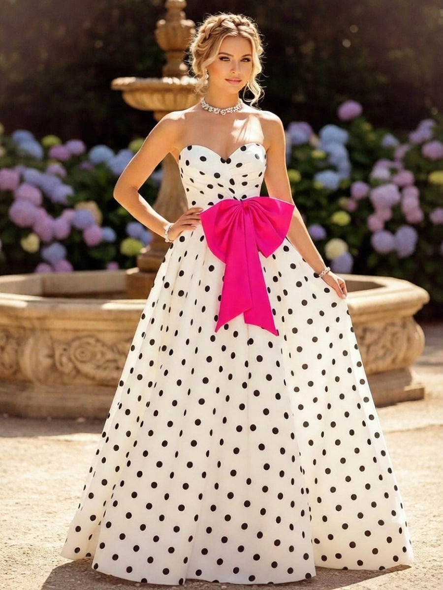 White and black polka dot satin ball gown prom dress with sweetheart neckline and fuchsia bow