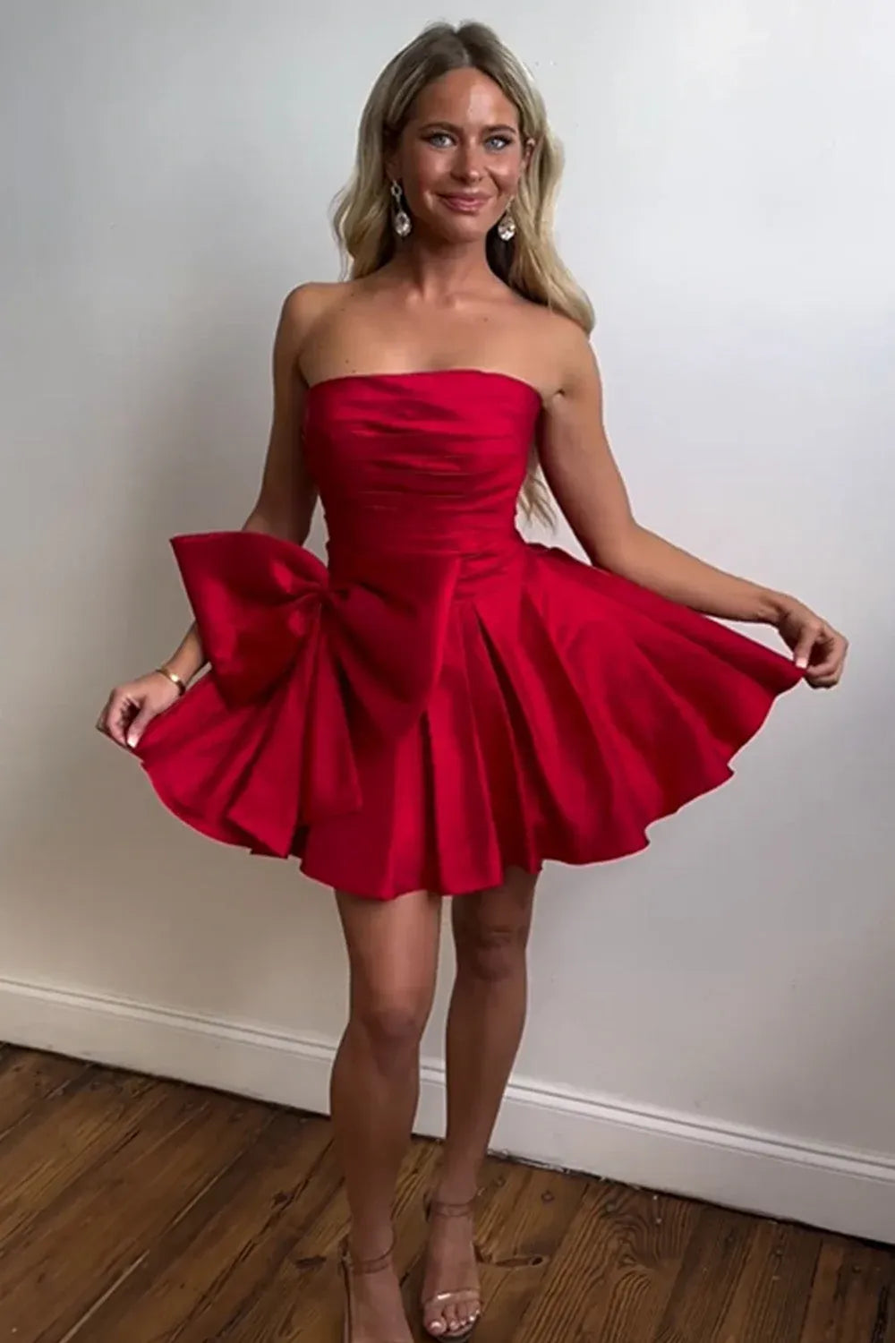 Loverlm raspberry red satin A-line mini homecoming dress with strapless neckline, ruched bodice, oversized side bow and flared skirt front view